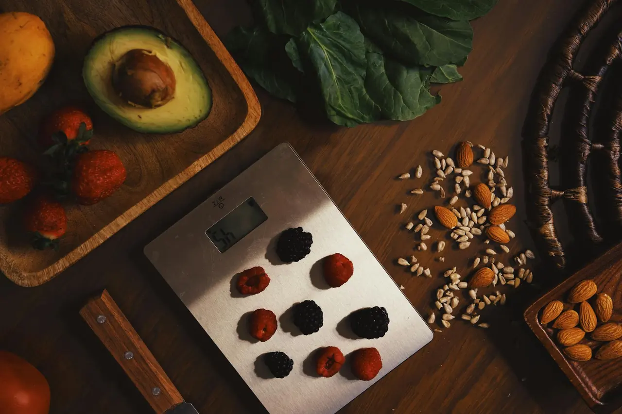 Healthy ingredients arranged on a kitchen scale, representing portion awareness and meal planning.
