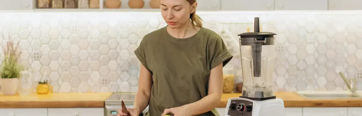 Woman preparing a healthy meal with fresh ingredients in a modern kitchen.