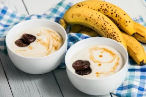 Small bowl of yogurt and banana prepared as a bedtime snack