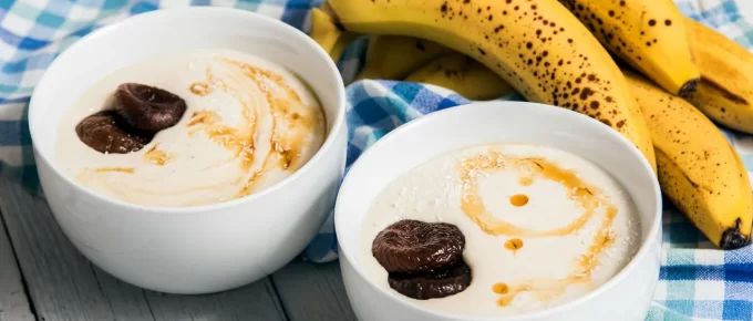 Small bowl of yogurt and banana prepared as a bedtime snack