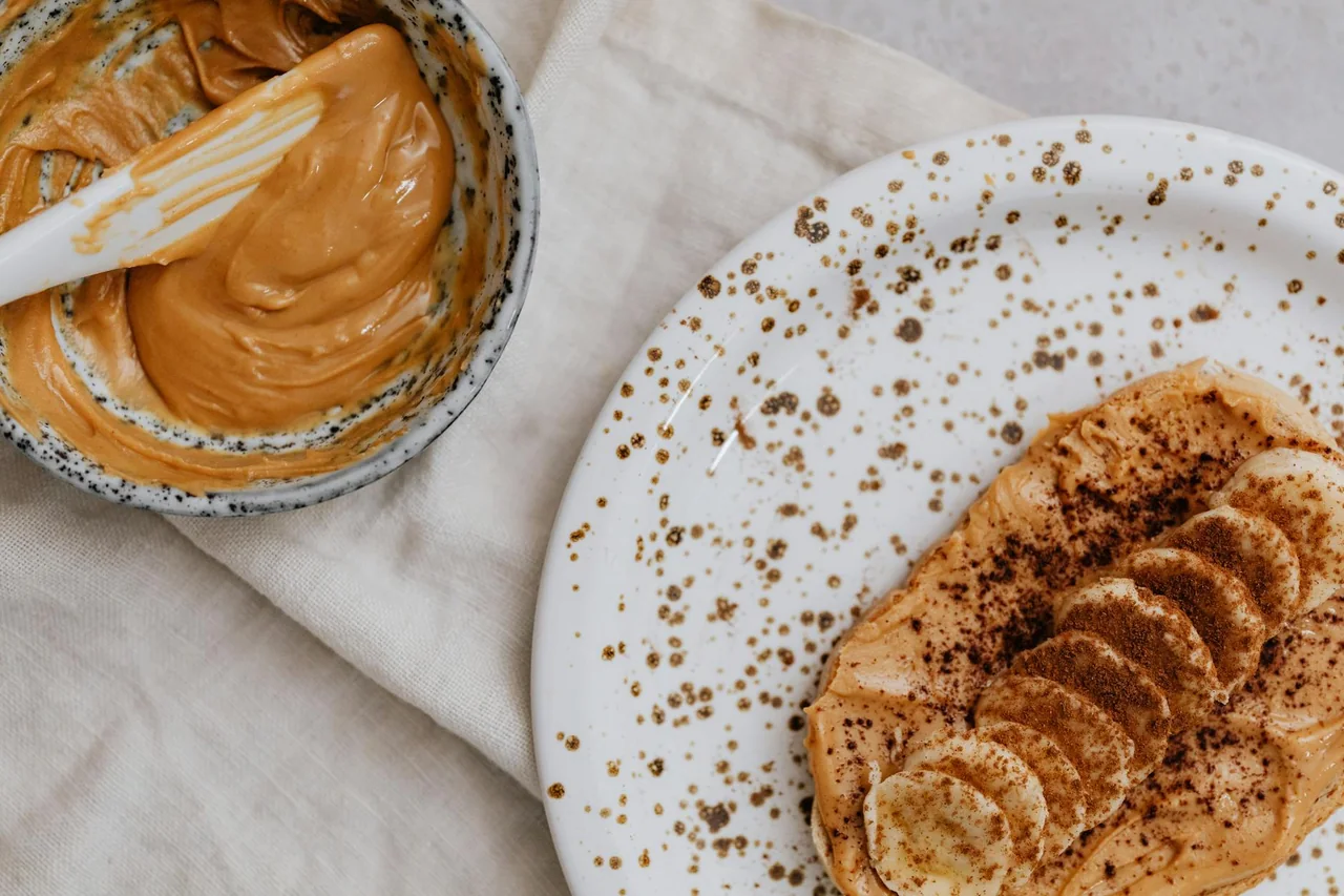 Piece of toast with peanut butter prepared as a light evening snack