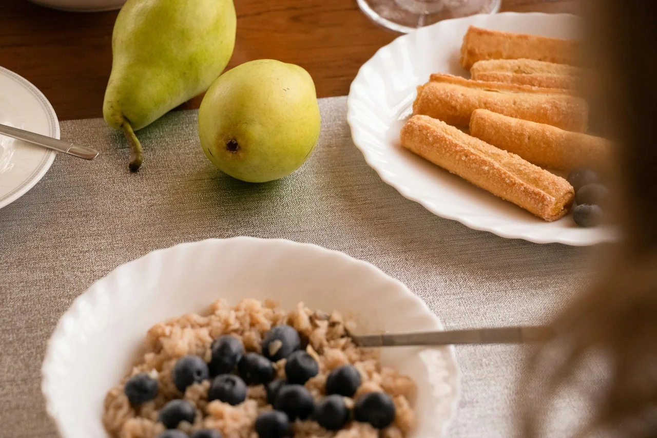 Warm bowl of oatmeal on a bedside table in soft evening light