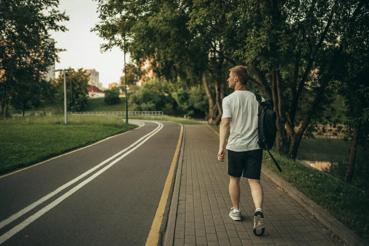 Person walking through a park for exercise