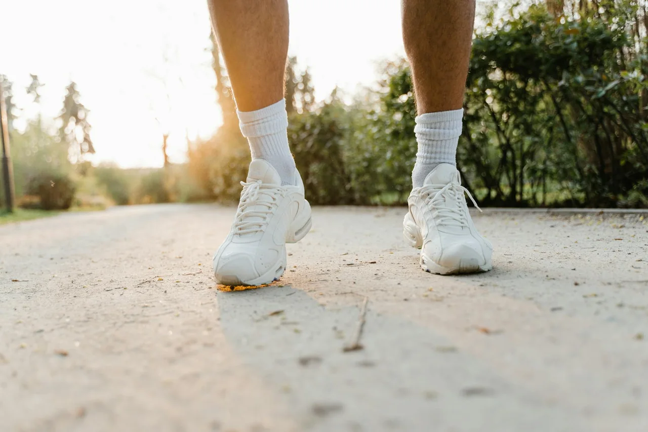 Walking shoes on a park path during a brisk walk