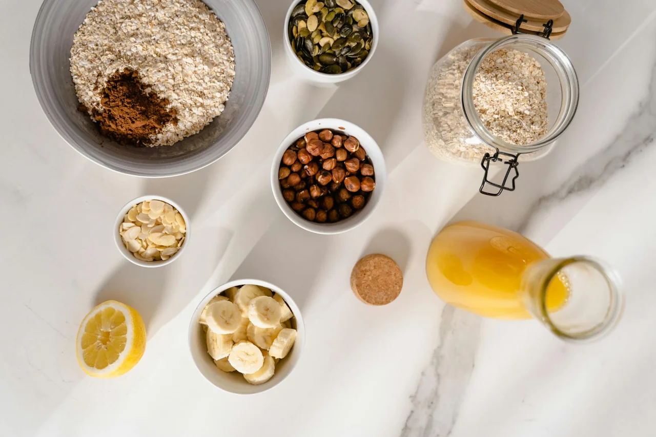 Warm bowl of oats with banana slices and cinnamon on a kitchen table