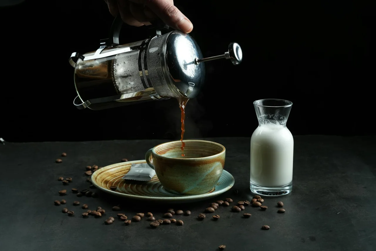 Two cups of coffee prepared with different brew methods