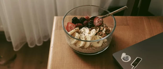Bowl of oats topped with berries and chia seeds