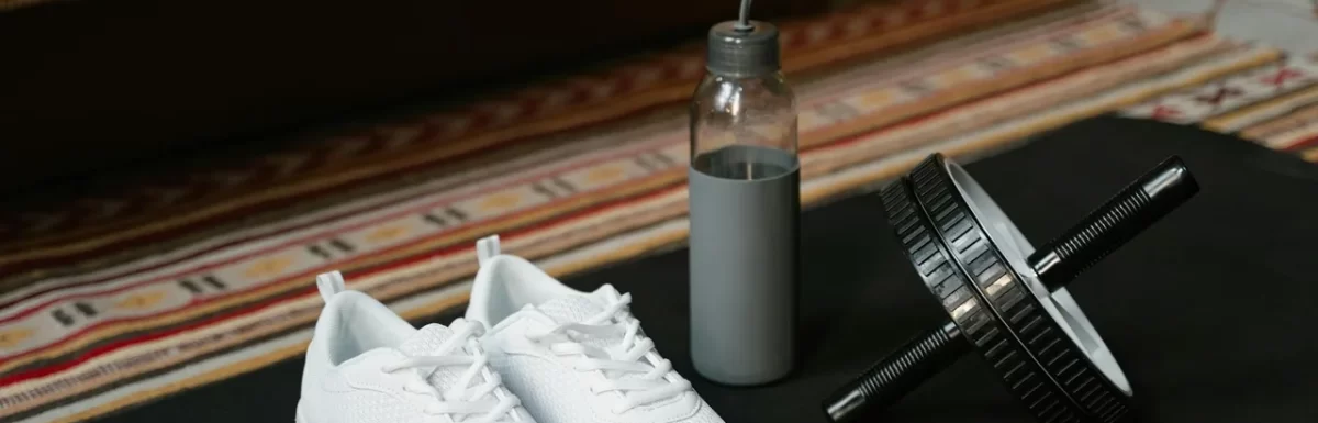 Foam roller, water bottle, and mat arranged for a recovery day