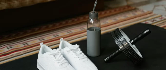 Foam roller, water bottle, and mat arranged for a recovery day