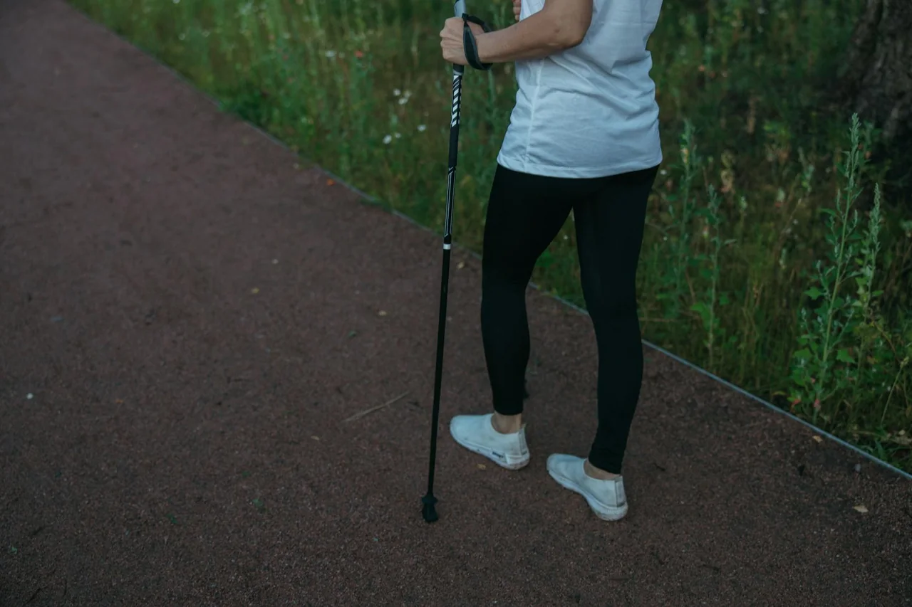 Person taking an outdoor walk as active recovery