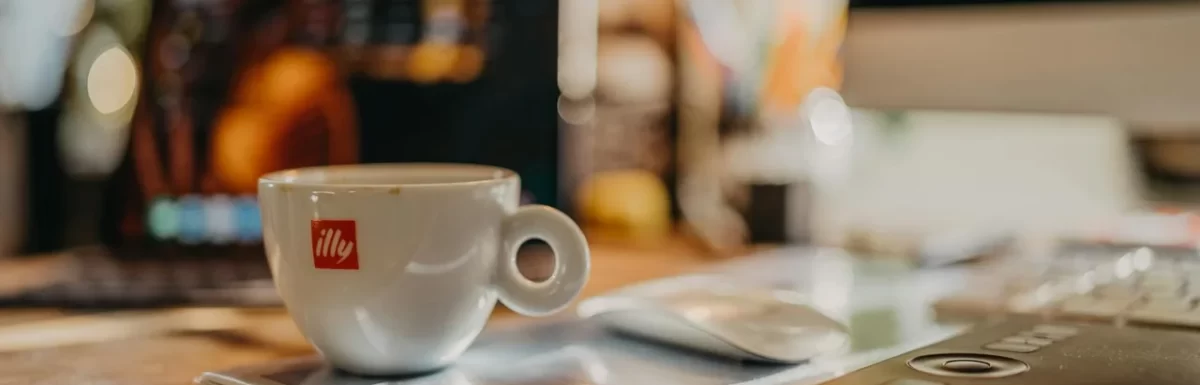 Coffee cups on a desk during a busy morning