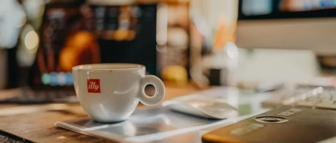 Coffee cups on a desk during a busy morning