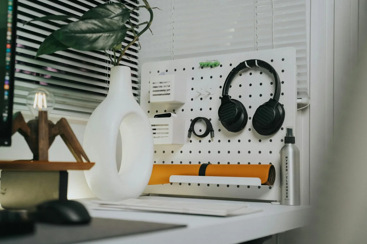 Calm home office desk with a laptop and water bottle