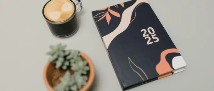 Planner, coffee, and walking shoes laid out for a balanced day