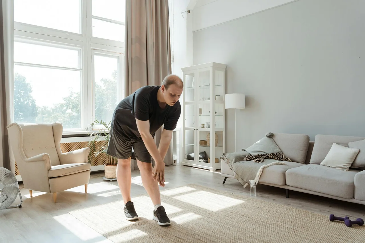 Beginner marching in place during home exercise