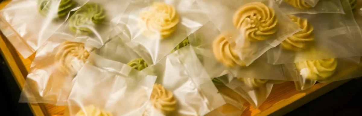 Plate of cookies and sweets on a kitchen counter at night