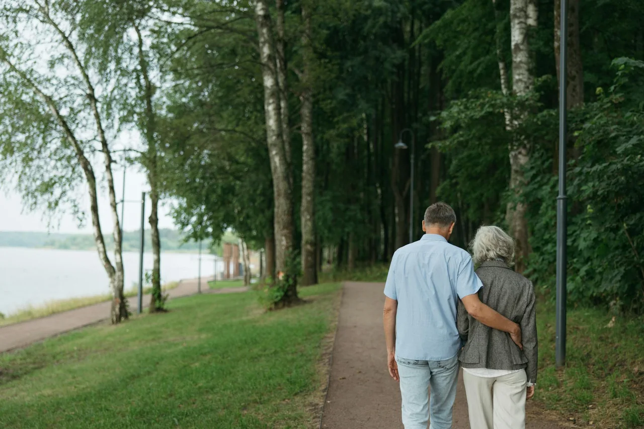 Person taking a gentle outdoor walk after a meal